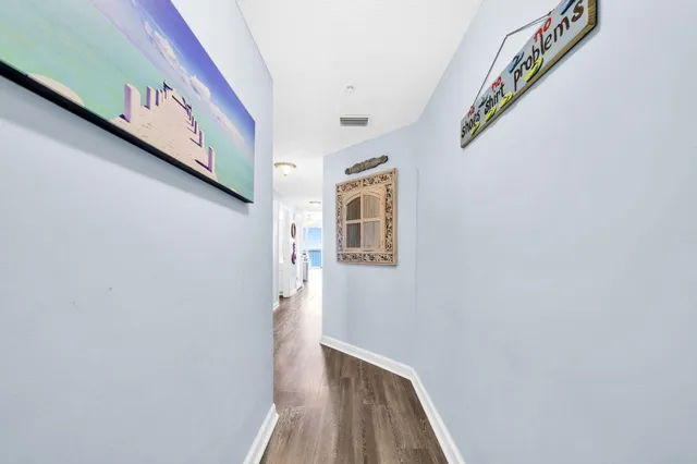 a view of an entryway with wooden floor