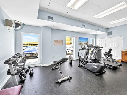 a bedroom with a bed and a chair