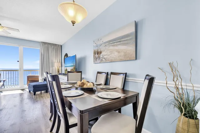 a view of a dining room with furniture and wooden floor