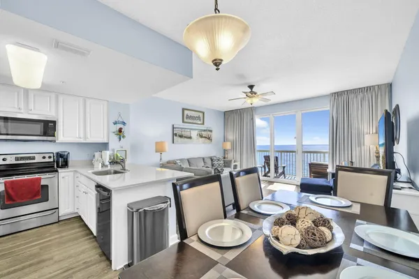 a view of kitchen island dining table and chairs