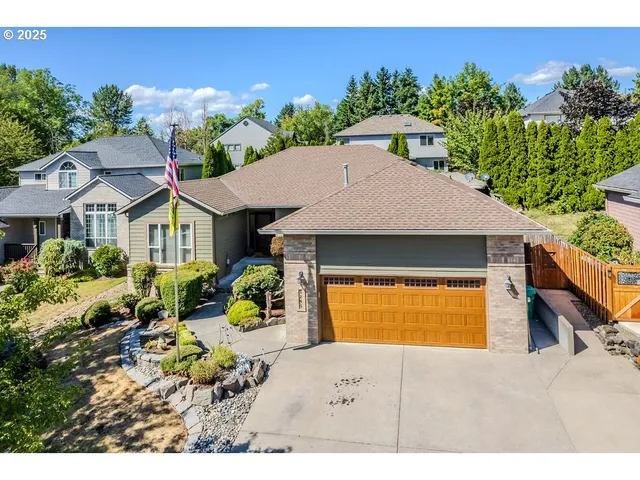 a aerial view of a house with a yard