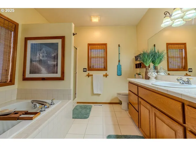 a bathroom with a sink double vanity and a mirror