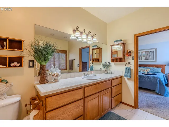 a picture of a bathroom with a sink and mirror