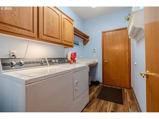 a view of a house with a yard and sitting area