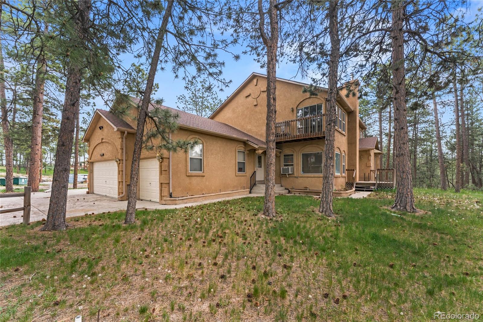 16575 Roller Coaster Road Colorado Springs, CO 80921 - Photo 2 of 26 front view of a house with a yard