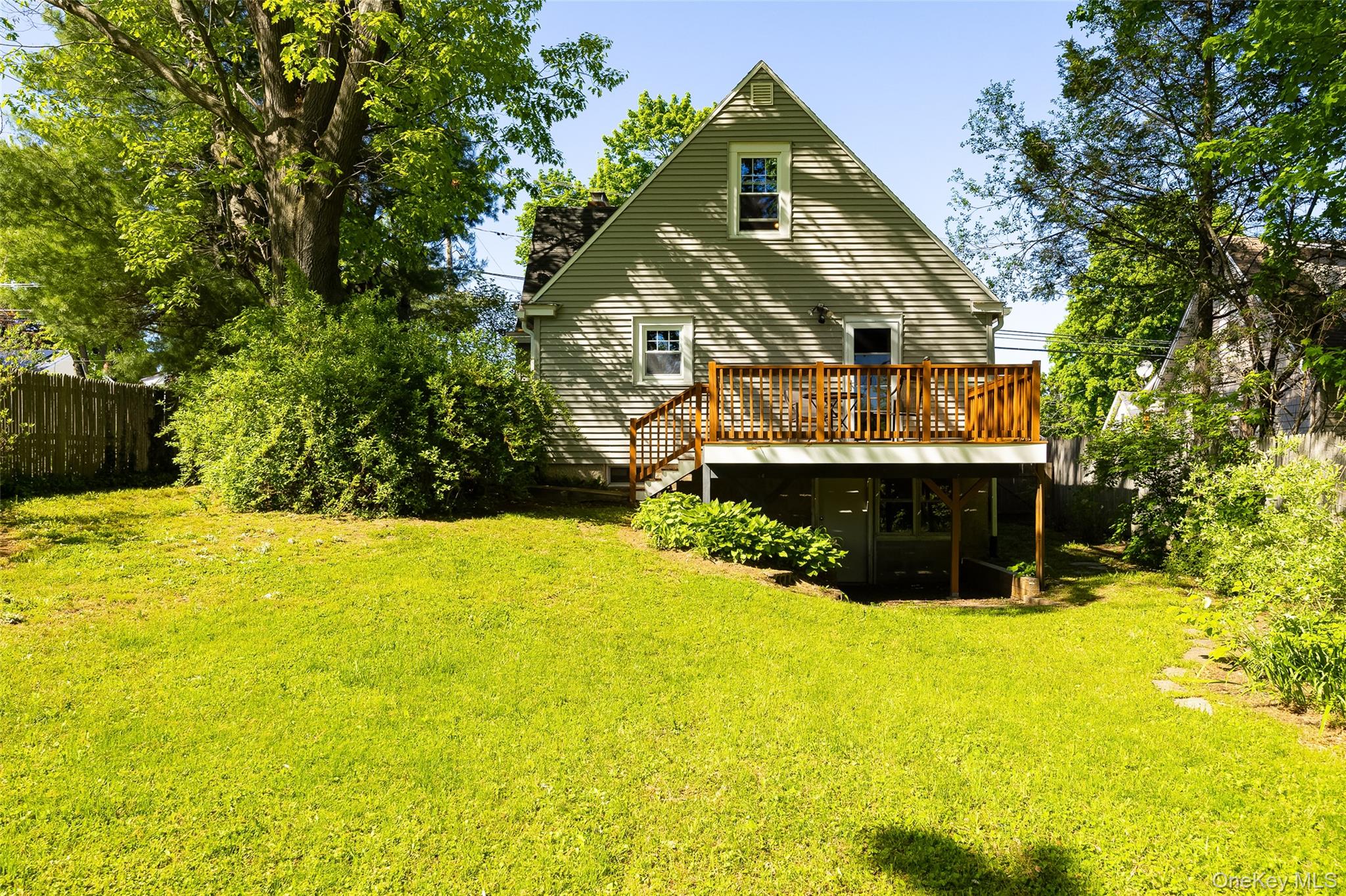 30 Marple Road Poughkeepsie, NY 12603 - Photo 7 of 26 Rear exterior with siding, featuring a wood deck with railings and steps to the yard