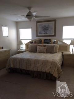 832 Pontoon Way Oxnard, CA 93035 - Photo 11 of 24 a bedroom with a bed and a lamp on table