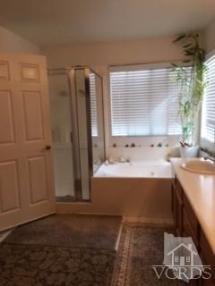 832 Pontoon Way Oxnard, CA 93035 - Photo 12 of 24 a bathroom with a tub sink and window
