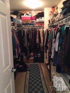 832 Pontoon Way Oxnard, CA 93035 - Photo 14 of 24 a view of walk in closet with clothes and shoes