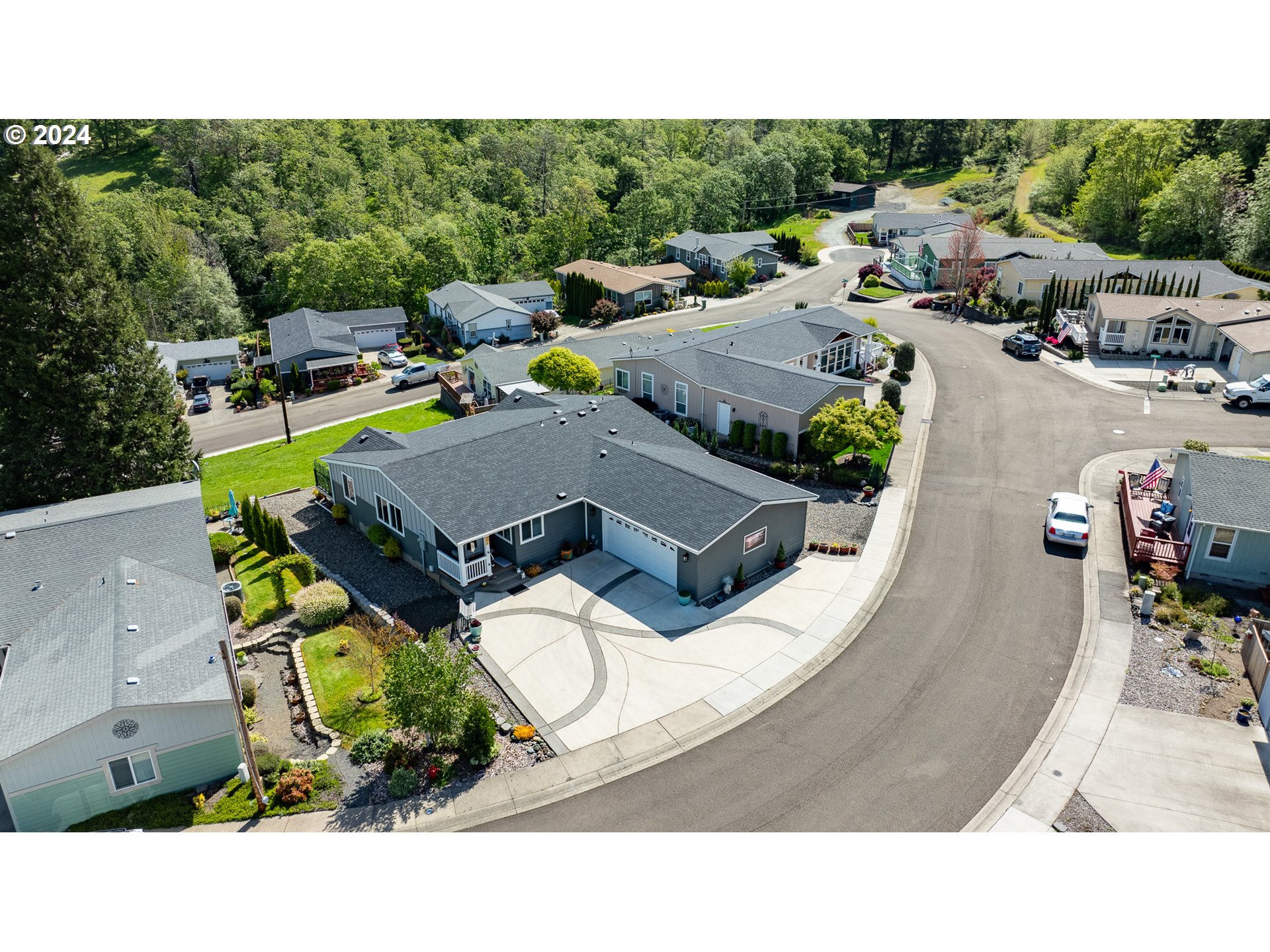 204 Lucky Ridge Loop Canyonville, OR 97417 - Photo 2 of 41 a aerial view of a house with a swimming pool