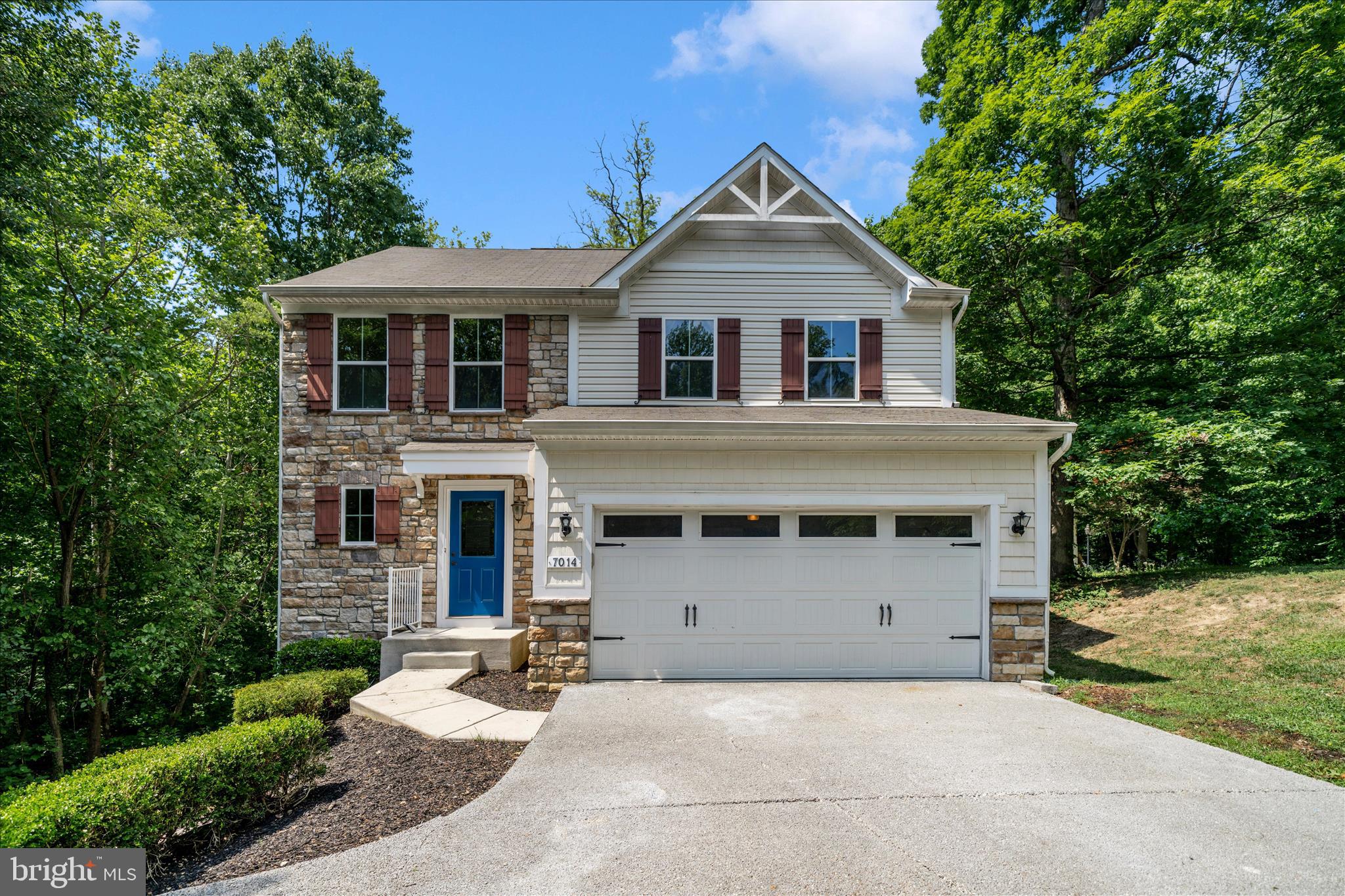 7014 Linden Avenue Elkridge, MD 21075 - Photo 1 of 42 a front view of a house with a yard and garage