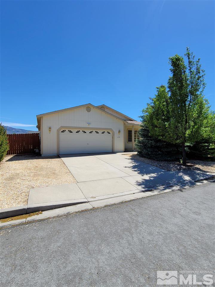 17756 Fortune Court Reno, NV 89508 - Photo 1 of 28 a big house with a large tree in front of it