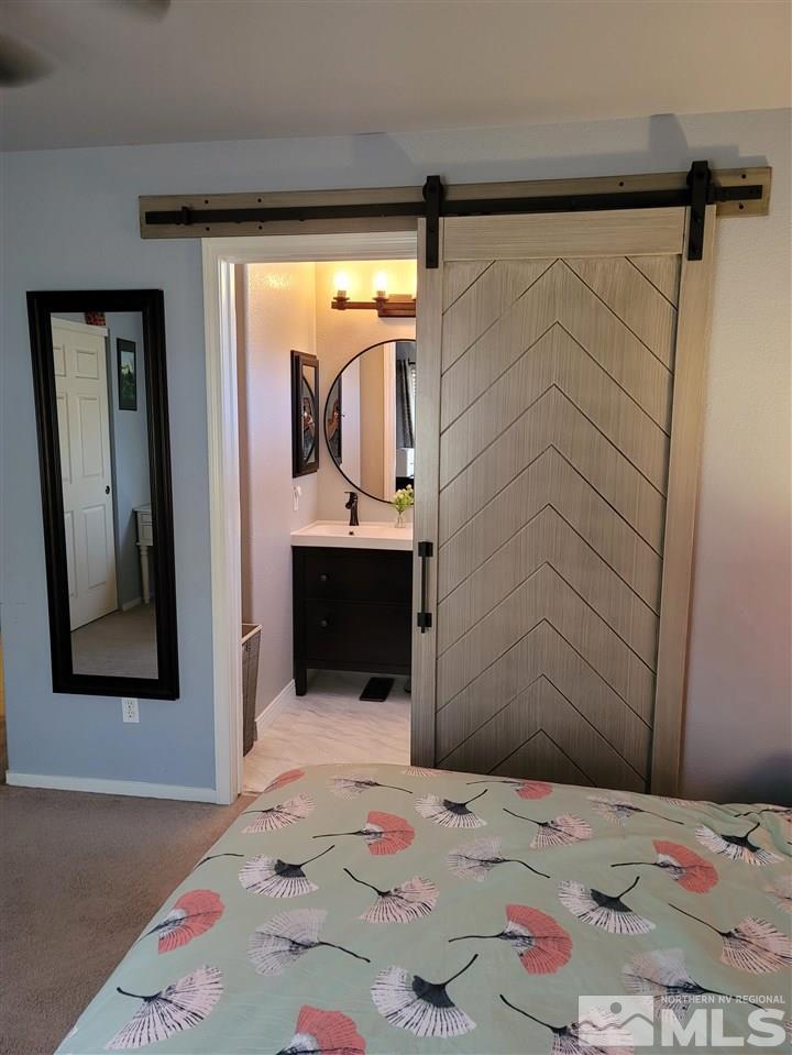 17756 Fortune Court Reno, NV 89508 - Photo 11 of 28 a bed in a bedroom next to a window
