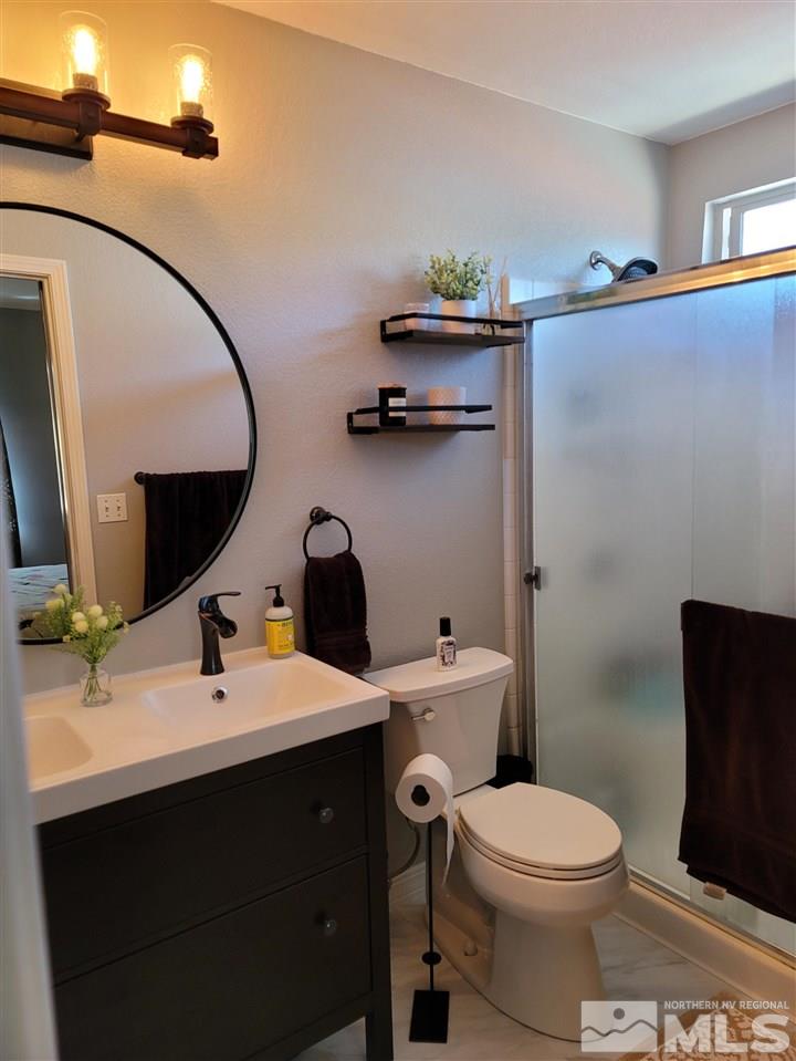 17756 Fortune Court Reno, NV 89508 - Photo 12 of 28 a bathroom with a sink toilet and mirror