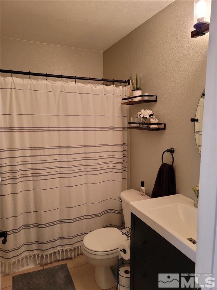 17756 Fortune Court Reno, NV 89508 - Photo 16 of 28 a bathroom with a toilet and a shower