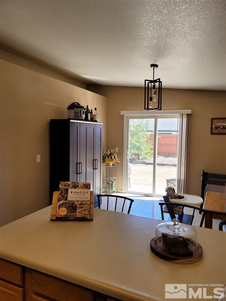 17756 Fortune Court Reno, NV 89508 - Photo 4 of 28 a living room with furniture and large window