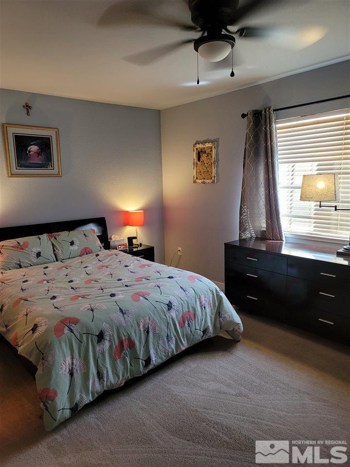 17756 Fortune Court Reno, NV 89508 - Photo 9 of 28 a bedroom with a bed and a window