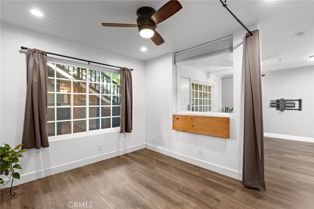 2800 Keller Drive, Unit 262 Tustin, CA 92782 - Photo 16 of 41 a view of an empty room with wooden floor and a window