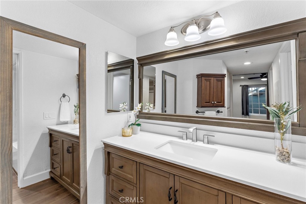 2800 Keller Drive, Unit 262 Tustin, CA 92782 - Photo 18 of 41 a bathroom with a sink and a mirror