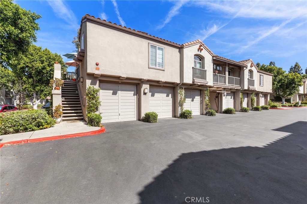 2800 Keller Drive, Unit 262 Tustin, CA 92782 - Photo 21 of 41 a front view of a house with a road