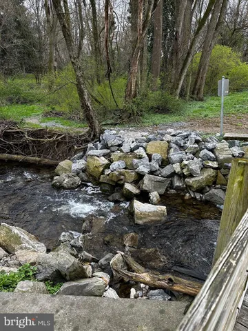 a view of a street with a yard