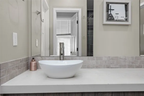 a bathroom with a bathtub and shower