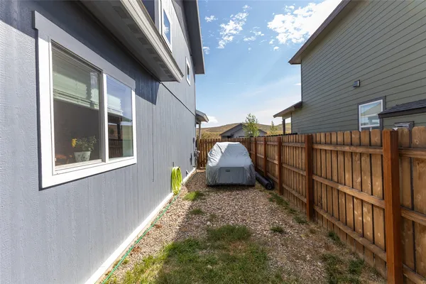 a bathroom with a granite countertop shower and a sink