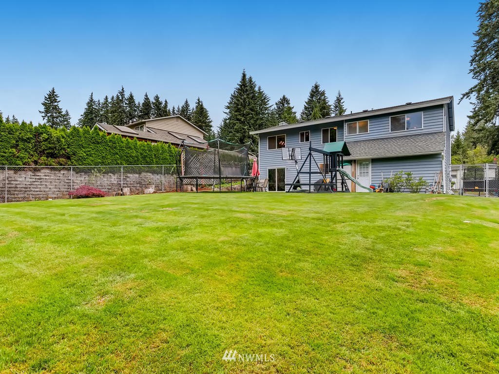 432 158th Street Southeast Bothell, WA 98012 - Photo 22 of 27 a view of a house with a yard and sitting area