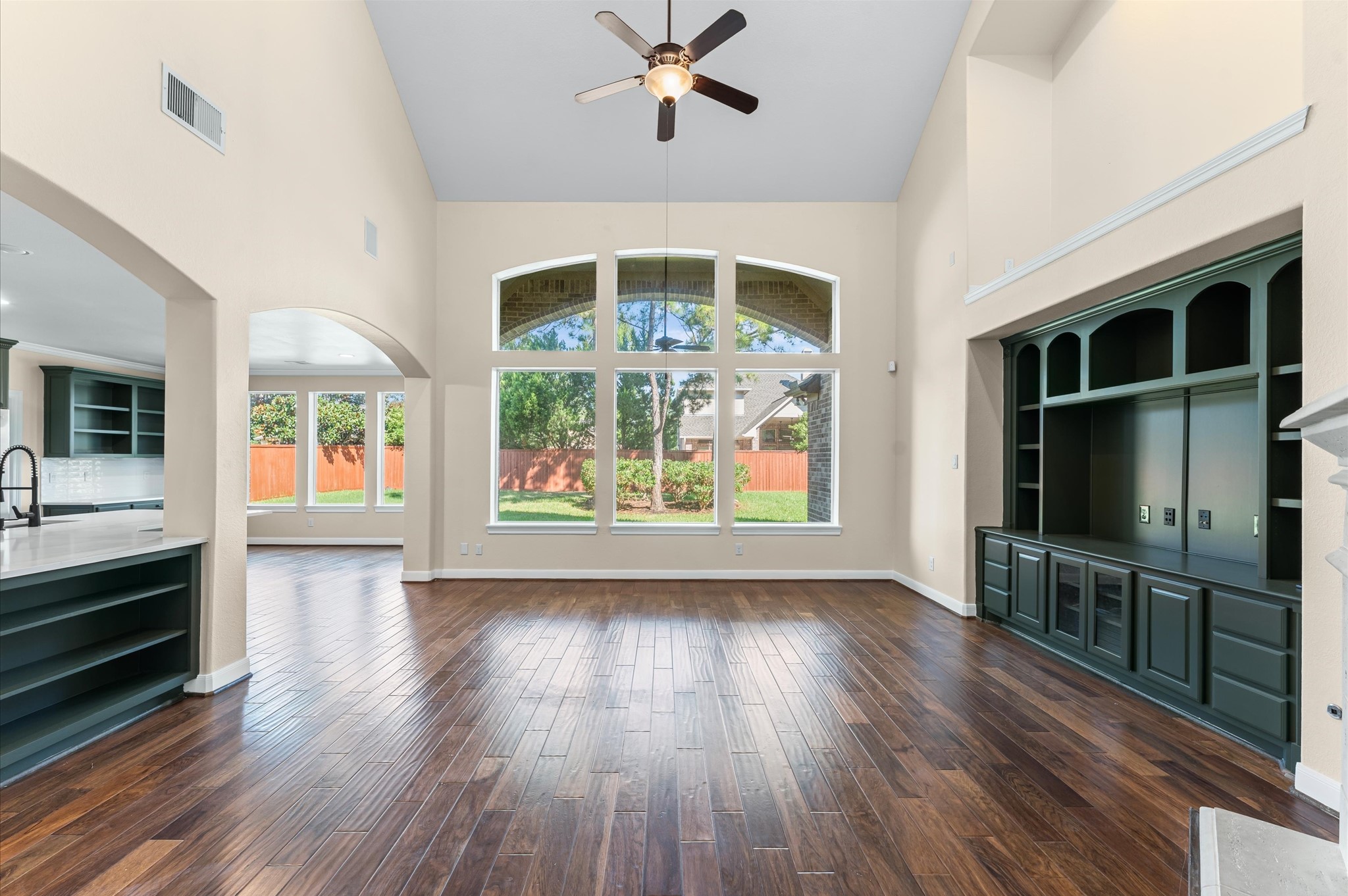 7 North Beech Springs Circle Spring, TX 77389 - Photo 8 of 50 a view of a livingroom with furniture flat screen tv wooden floor and windows