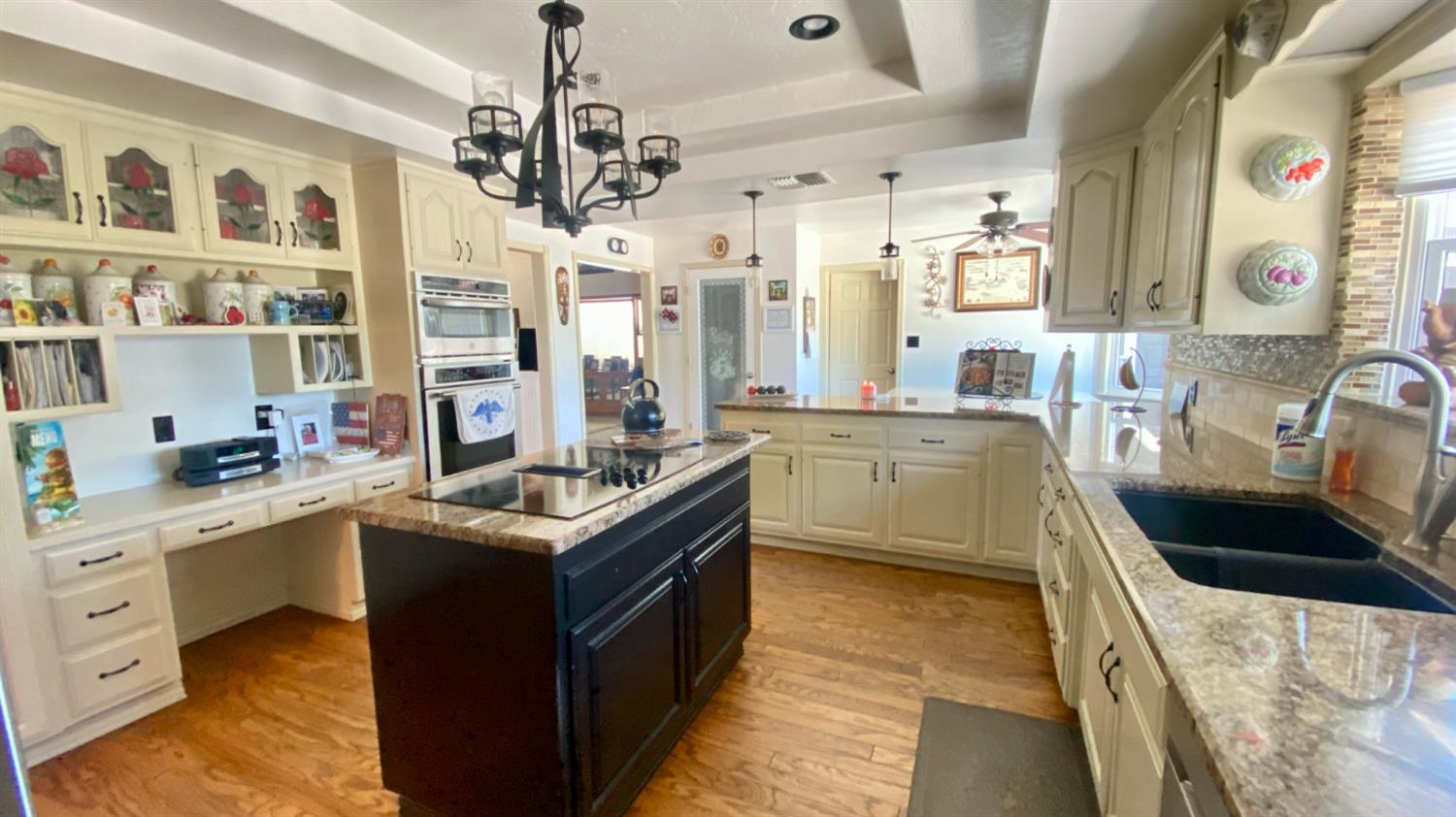 5012 Ustick Road Modesto, CA 95358 - Photo 14 of 26 a kitchen with stainless steel appliances granite countertop a sink stove and cabinets