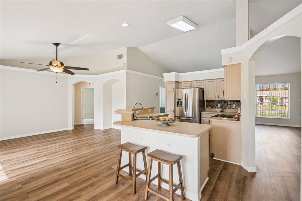 893 Watt Circle Deltona, FL 32738 - Photo 15 of 34 a kitchen with a table and chairs