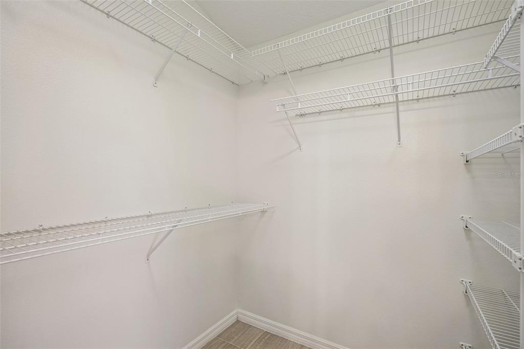 893 Watt Circle Deltona, FL 32738 - Photo 22 of 34 a view of a room with racks on the wall
