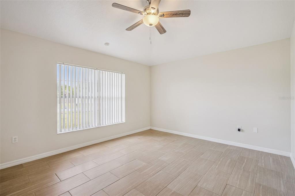 893 Watt Circle Deltona, FL 32738 - Photo 24 of 34 a view of an empty room with a window