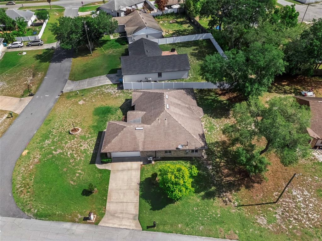 893 Watt Circle Deltona, FL 32738 - Photo 30 of 34 an aerial view of a house with garden space and a street view