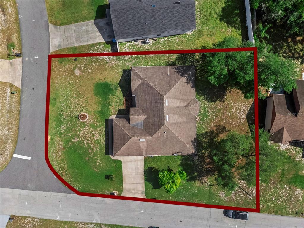 893 Watt Circle Deltona, FL 32738 - Photo 32 of 34 an aerial view of a house with garden space and street view