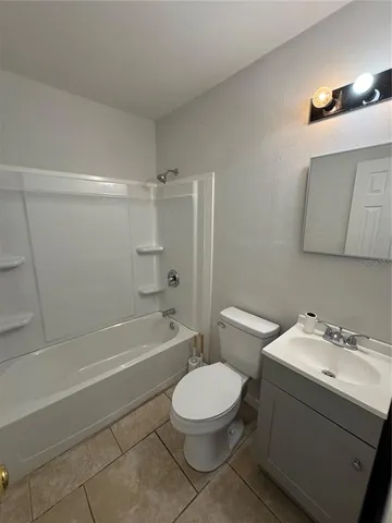 a bathroom with a sink a toilet and a bathtub