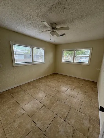a view of an empty room with a window