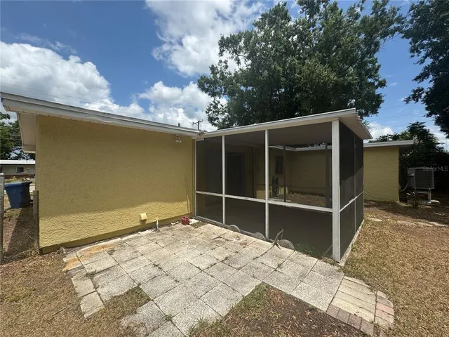 a backyard of a house with a yard and garage