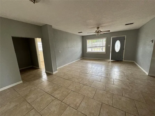 a view of an empty room and window