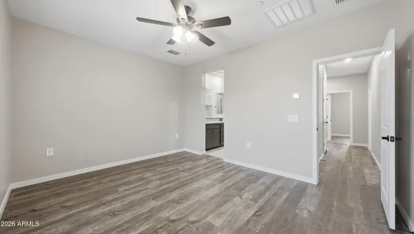 a bedroom with bed and a couch
