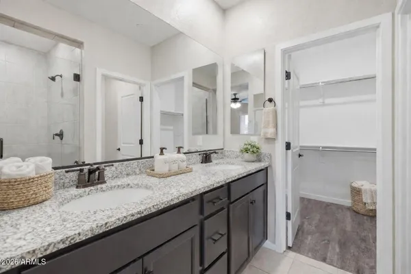 an empty room with a window and ceiling fan