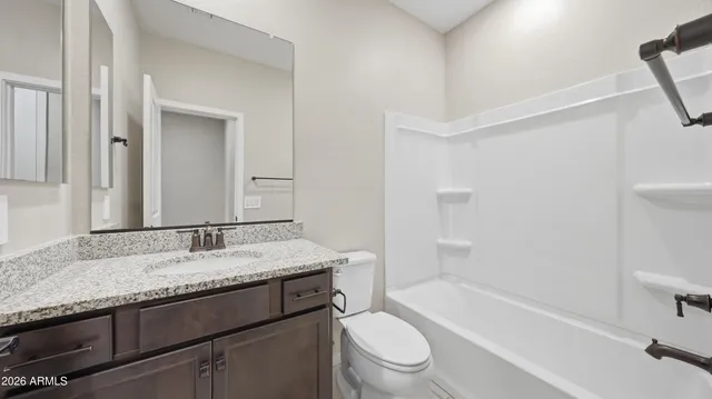 a view of a bathroom from the hallway