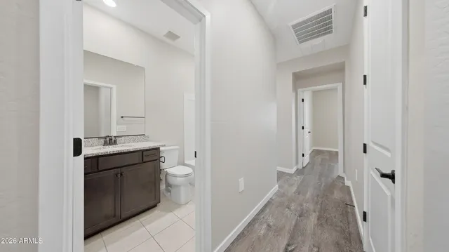 a view of a hallway with closet area