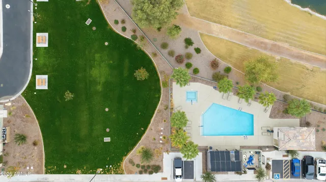 an aerial view of residential houses with outdoor space