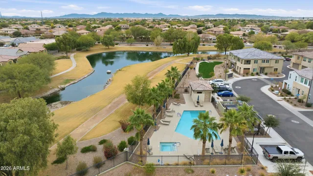 an aerial view of a house with a lake view