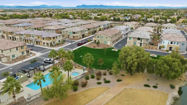 an aerial view of residential houses with outdoor space