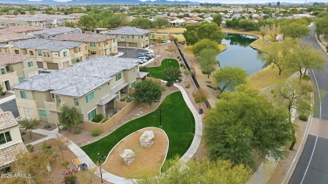 a view of a swimming pool with outdoor seating