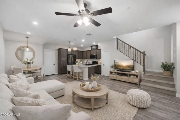 a large kitchen with stainless steel appliances kitchen island a large counter top and a stove top oven