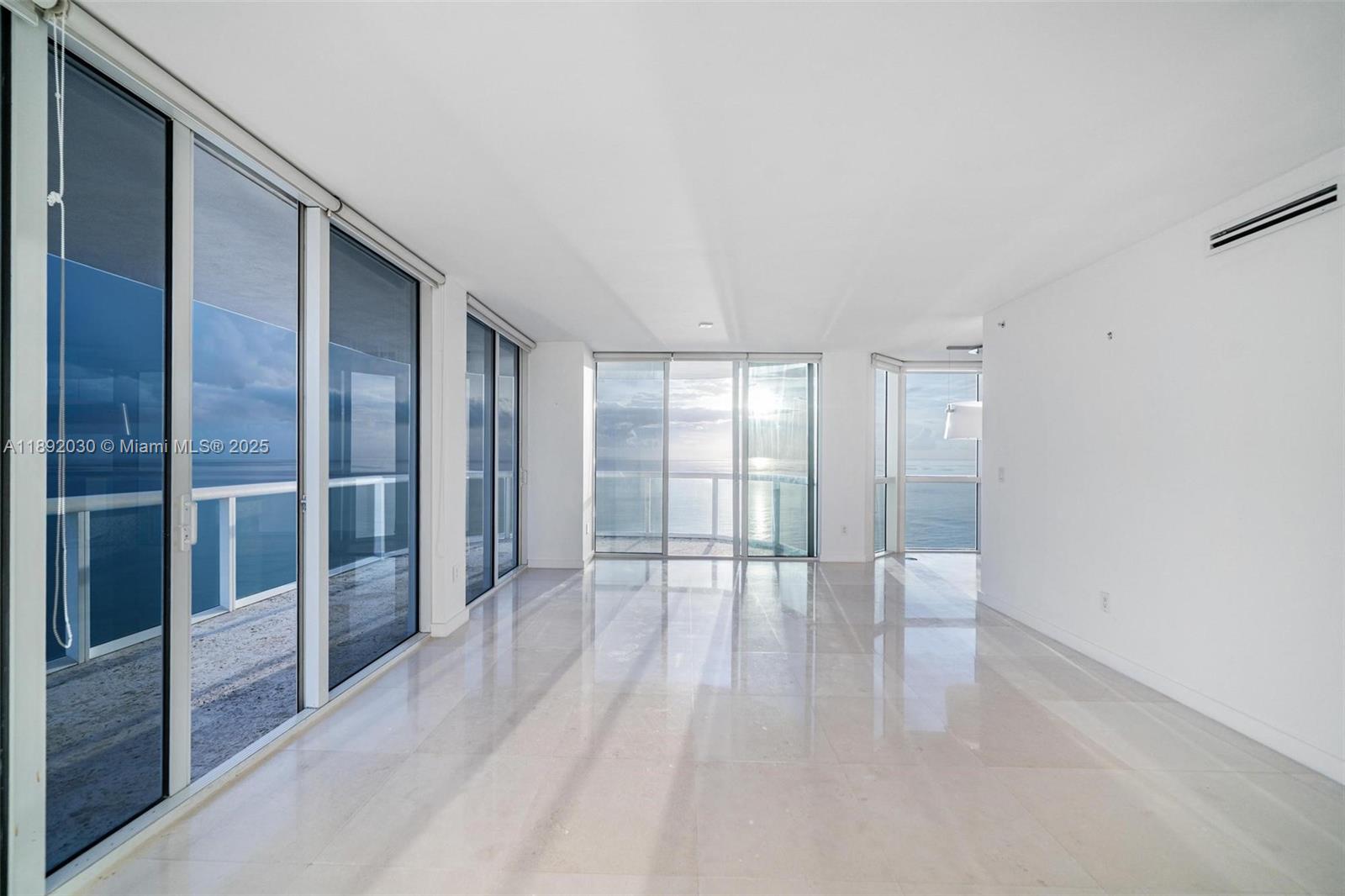 6365 Collins Avenue, Unit 2901 Miami Beach, FL 33141 - Photo 15 of 44 a view of an empty room and window