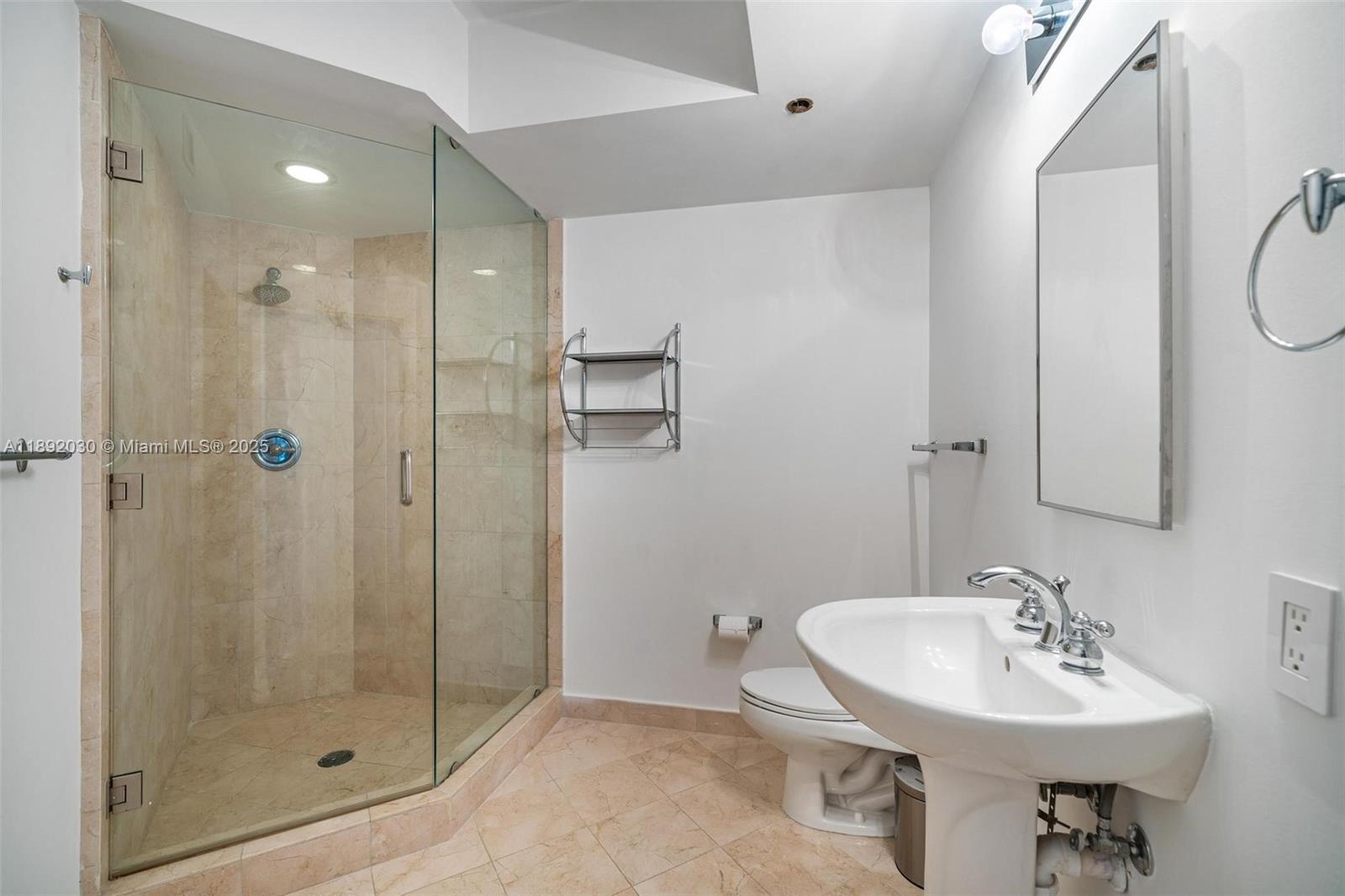 6365 Collins Avenue, Unit 2901 Miami Beach, FL 33141 - Photo 20 of 44 a bathroom with a sink shower and a mirror